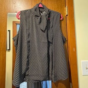 Ann Taylor botton down sleeveless blouse with a tie at the neck.